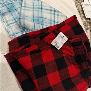 Women’s two pair Pajama Pants (red/black with tag, blue/white gently used)